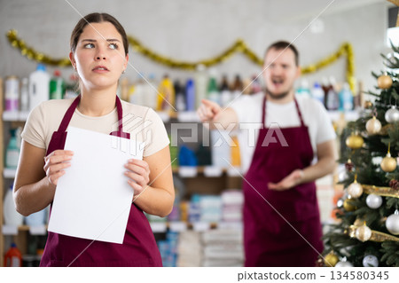 Male manager is unhappy with female salesperson - he yells at her and throws her out of work 134580345