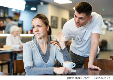 Girl rejects guy. Young man violates personal boundaries of girl Girl rejects guy. Young man violates personal boundaries of girl 134580373