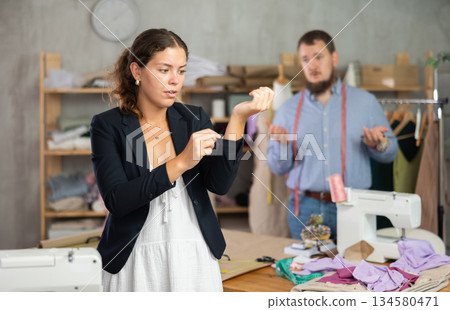 Female client dissatisfied with quality of custom blazer 134580471