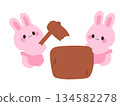 Illustration of a cute rabbit making mochi 134582278