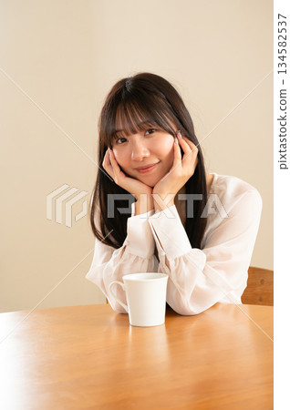 A lady with a cheeks stick 134582537