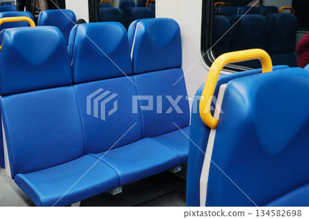 Clean interior of modern public transport vehicle with vacant seating Clean interior of modern public transport vehicle with vacant seating 134582698