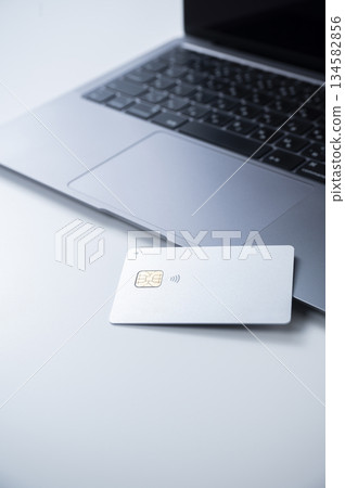 Credit card and laptop 134582856