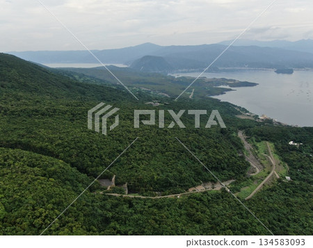 Aerial view of Route 224 along the coast of Sakurajima, Kagoshima City Aerial view of Route 224 along the coast of Sakurajima, Kagoshima City 134583093
