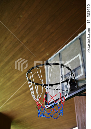 Looking up at the basketball goal Looking up at the basketball goal 134583630