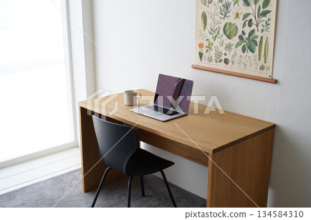 laptop on desk in office room laptop on desk in office room 134584310