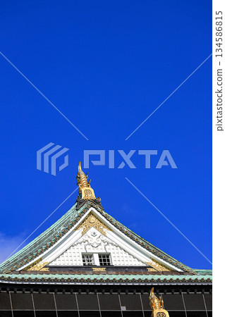 Close up detail of Osaka castle with autumn blue sky white cloud, frame one of japan's best destination for travel, Osaka Japan. 134586815