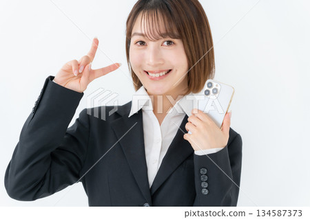 Young woman business smartphone Young woman business smartphone 134587373