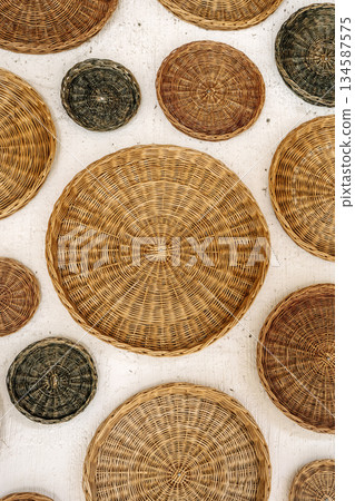 Woven Rattan Baskets Wall Decor Background Woven Rattan Baskets Wall Decor Background 134587575