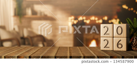 2026 new year wooden blocks calendar on table across fireplace and bricks wall with Christmas tree. 134587900