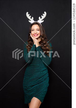 Beautiful young woman in festive dress Beautiful young woman in festive dress 134588519