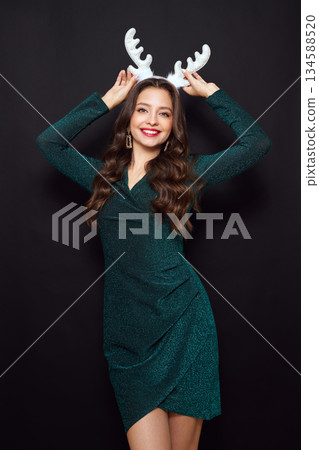 Beautiful young woman in festive dress 134588520