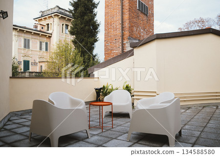 Cozy Terrace Seating with Modern White Chairs Cozy Terrace Seating with Modern White Chairs 134588580