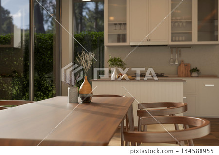 Set of wooden table and armchairs with decorative dried flower vase in modern kitchen or dining room Set of wooden table and armchairs with decorative dried flower vase in modern kitchen or dining room 134588955