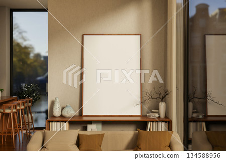 Large blank drawing or photo frame on wooden bookshelf in front of a wall in cosy stye living room. Large blank drawing or photo frame on wooden bookshelf in front of a wall in cosy stye living room. 134588956