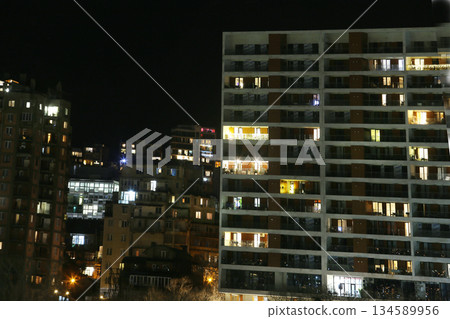 Christmas decorations on the balcony of a multi-story building in Tbilisi (they twinkle) Christmas decorations on the balcony of a multi-story building in Tbilisi (they twinkle) 134589956