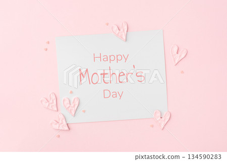 Happy Mothers Day greeting card on pink background. Holiday concept. 134590283