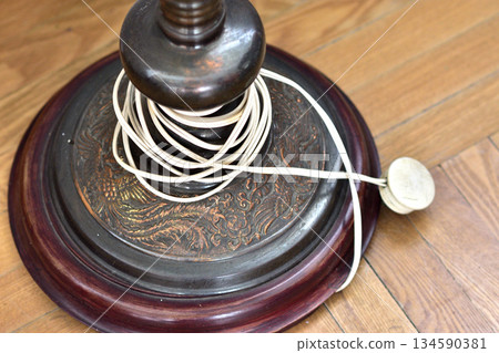 Vintage Lamp Base with Intricate Carvings and Coiled Cord Vintage Lamp Base with Intricate Carvings and Coiled Cord 134590381