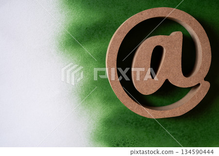 At sign on a green background 134590444