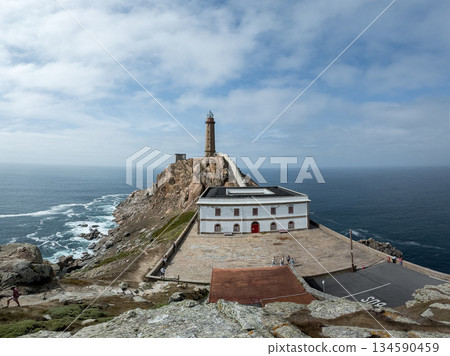 Majestic Lighthouse Overlooking the Atlantic Ocean in Galicia 134590459