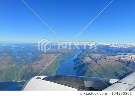 A view of the fjord near the coastline from the plane to Bergen Airport 134590861