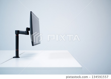 studio shot of light bulb on white desk 134591557