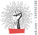 Rised fist hand gesture emblem. Vector hand clenched into fist and rising up, symbol isolated on white background. Power sign. Human hand up in the air 134592188