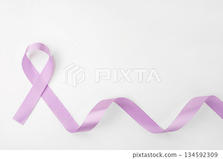 Lilac ribbon on white background. World Cancer Day on February 4. 134592309