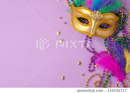 Mardi Gras and fat Tuesday background. Festive decorations on a lilac background 134592317