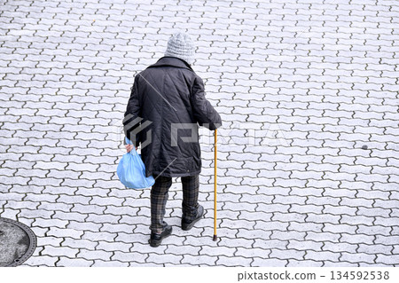 Yokohama cityscape in Japan: Walking sticks are a killer on the sidewalks... Hard-to-see undulations, steps, and unevenness... Elderly people with walking sticks need to be careful... Four-wheeled carts, etc. 134592538