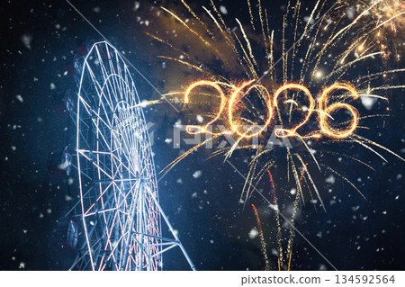 Happy New Year 2026 Celebration. Fireworks display with numbers 2026 written in light against a night sky with snow and a brightly lit Ferris wheel. Festive winter holiday scene Happy New Year 2026 Celebration. Fireworks display with numbers 2026 written in light against a night sky with snow and a brightly lit Ferris wheel. Festive winter holiday scene 134592564