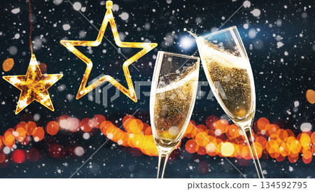 Two champagne flutes clinking against a winter night background with glowing stars and bokeh lights. Perfect for Christmas celebrations, New Year greeting cards, and magical holiday event promotions 134592795