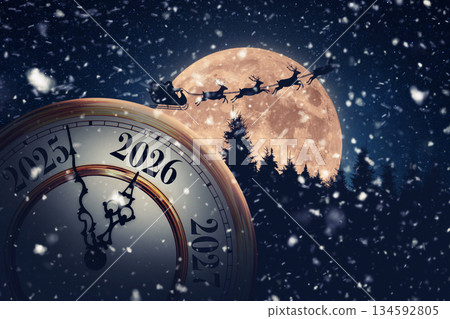 Magical holiday time transition to 2026. A snowy, New Year's Eve clock is set against a massive full moon with Santa Claus and his reindeer flying across the dark, festive sky. Magical holiday time transition to 2026. A snowy, New Year's Eve clock is set against a massive full moon with Santa Claus and his reindeer flying across the dark, festive sky. 134592805