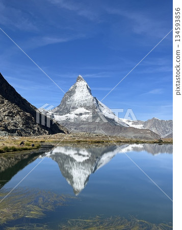 Beautiful upside-down Matterhorn reflected on the lake surface 134593856