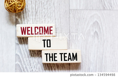 Welcome to our team symbol. Wooden blocks with words 'Welcome to our team'.Copy space. 134594498