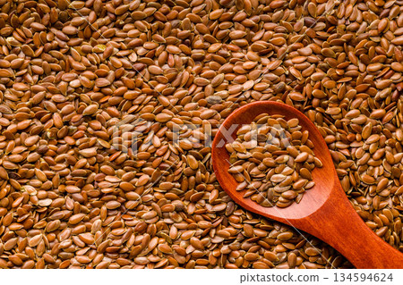 Brown linseed or flaxseed and oil. Healthy flax seed. Top view. Brown linseed or flaxseed and oil. Healthy flax seed. Top view. 134594624