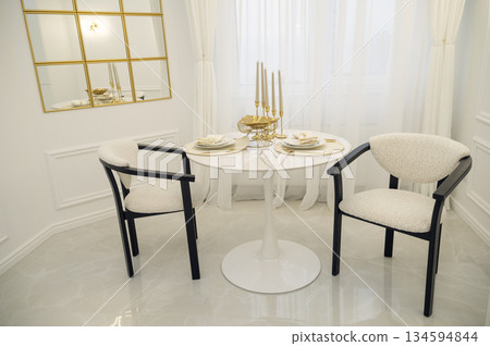 contemporary dining room featuring elegant design elements, modern furniture and natural light 134594844