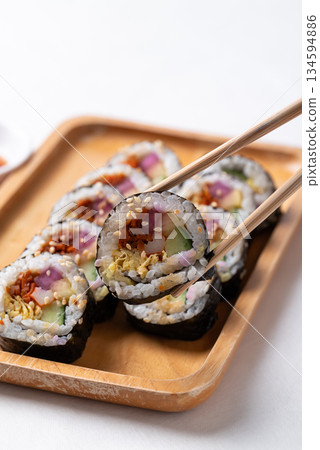 Kimbap, Korean food made from cooked rice with vegetables, egg and wrapped with dried seaweed Kimbap, Korean food made from cooked rice with vegetables, egg and wrapped with dried seaweed 134594886