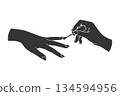 Silhouette icon of a hand applying nail polish 134594956