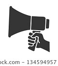 Silhouette icon of a hand holding a loudspeaker 134594957