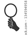 Silhouette icon of a hand holding a hand mirror 134594958
