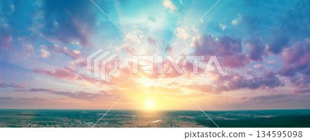 Panorama of the countryside with beautiful colorful evening sky during sunset. View from above Panorama of the countryside with beautiful colorful evening sky during sunset. View from above 134595098