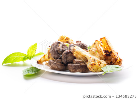 Roasted vegetables with cauliflower and mushrooms in warm tones Roasted vegetables with cauliflower and mushrooms in warm tones 134595273