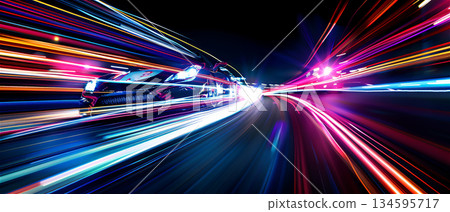 The light trail of a sports car racing through the city at night The light trail of a sports car racing through the city at night 134595717