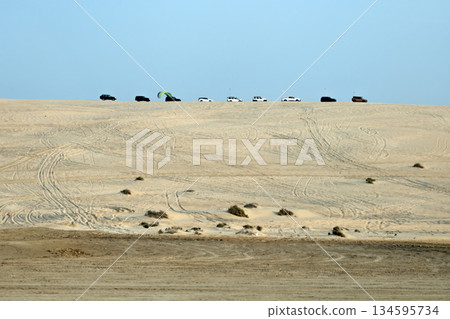Luxury jeep safari in the Qatari desert. Luxury jeep safari in the Qatari desert. 134595734