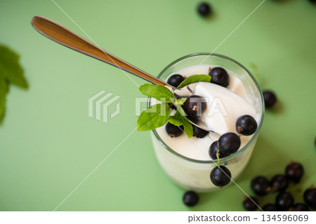 Blackcurrant in homemade yogurt, top view 134596069