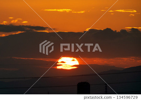 Yokohama cityscape in Japan. The gloom of the Japanese economy... The sun setting through the clouds. The sky is dyed orange... What will tomorrow bring... 134596729