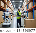 Workers working alongside humanoid robots 134596977