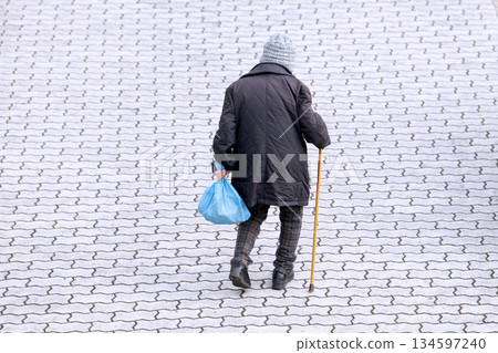 Yokohama cityscape in Japan: Hard-to-see steps and uneven surfaces...aging society...elderly woman with a cane...chilling with the winter solstice 134597240