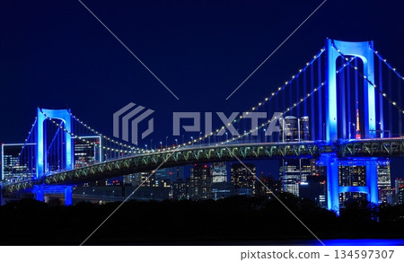 Illuminated Rainbow Bridge seen from Daiba Station on the Yurikamome Line in Tokyo 134597307